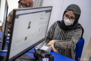 Indonesia trying to restore immigration services after system outage