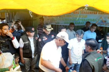 Bupati Kampar apresiasi reaksi cepat PTPN V bantu korban banjir di Desa Kasikan