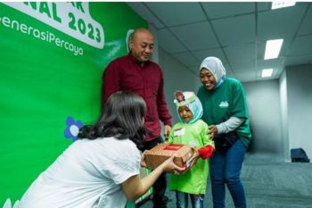 Ribuan anak Mitra Pengemudi Grab rayakan HAN dengan sepatu desain khusus gratis