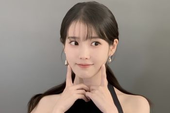 IU tulis lagu dalam album barunya