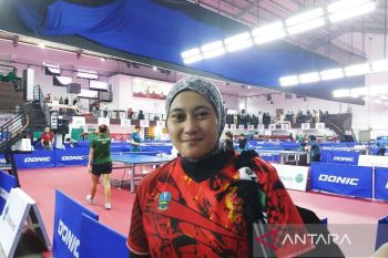 Cerita jilbab loreng atlet tenis meja Christine Ferliana yang disebut bawa hoki