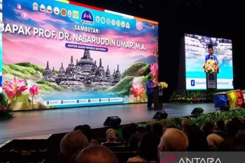 Minister calls for sustaining harmony at Buddhist conference