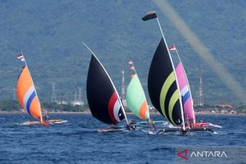 Colorful sails light up Bali Strait traditional boat race