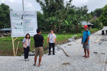 PLN salurkan bantuan pembangunan jalan Desa Tempang Dua Minahasa