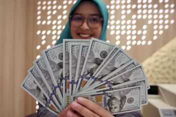 Saatnya Indonesia mengurangi ketergantungan pada dolar
