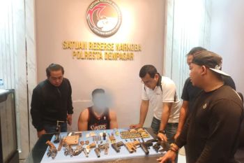 Bali police probe gun cache found in drug raid