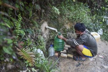 Pemanfaatan mata air di kebun sawit saat kemarau