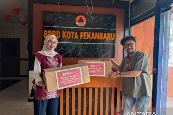 Peduli dampak asap karhutla, Alfamart Pekanbaru bagikan 1.500 masker untuk warga