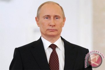 Putin memuji Chavez