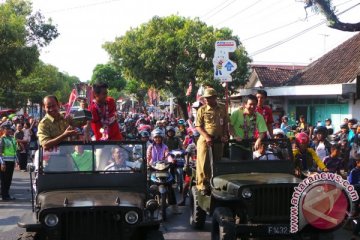 Tontowi, Hendra, Ahsan diarak di Purwokerto