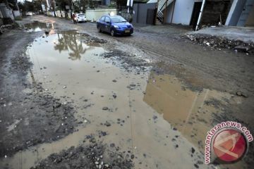 JALAN RUSAK AKIBAT BANJIR
