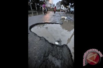 JALAN RUSAK AKIBAT BANJIR