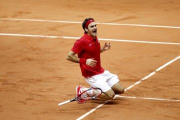 Federer melaju ke perempat final Halle