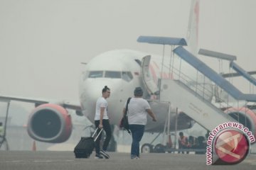 Kabut asap membuat penerbangan Indonesia sulit ke Kategori 1