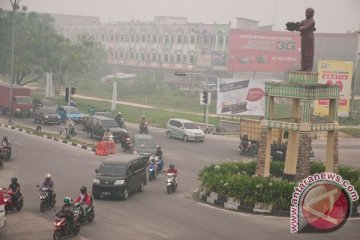 Peringatan HUT TNI di Pekanbaru diselimuti asap