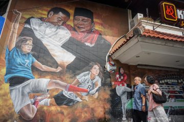 Mural berisi pesan persatuan dan kesatuan