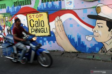 Mural imbauan stop calo pungli