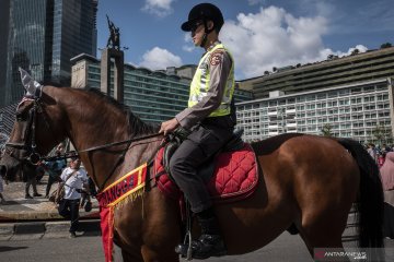 Polisi berkuda saat hari bebas kendaraan bermotor di Jakarta