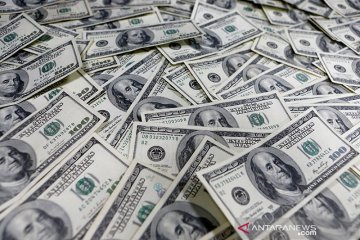 Dolar menguat setelah Fed meningkatkan prospek ekonomi AS