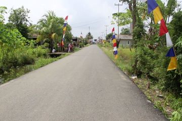 Penantian 12 tahun,  jalan rusak Merah Mata kini beraspal