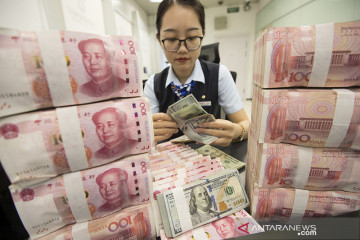 Yuan terangkat 211 basis poin menjadi 6,9535 terhadap dolar AS