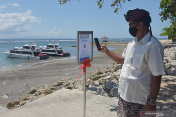 Penerapan aplikasi PeduliLindungi di Pantai Sanur