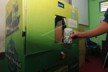 Inovasi alat pemilah sampah berkonsep ATM
