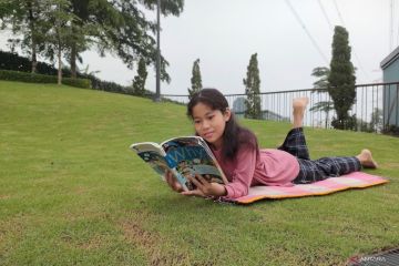 Merengkuh dunia dengan membaca
