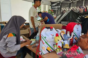 Merchandise resmi, jodoh sah dan pengikat memori pesta olahraga