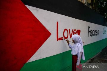 Aksi solidaritas peringatan satu tahun agresi Israel ke Palestina