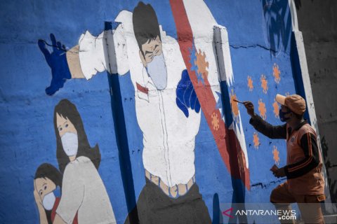 Mural waspada virus Corona