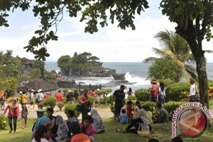 Tanah Lot in bali attracts two hundred thousand tourists