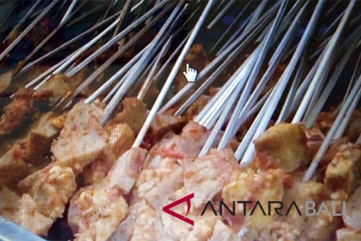 Balinese muslims break their fast with cow's teat satay