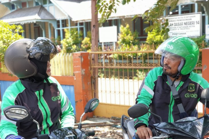 Fahrul - Yeni, suami istri driver GrabBike Pontianak yang ikut beramal