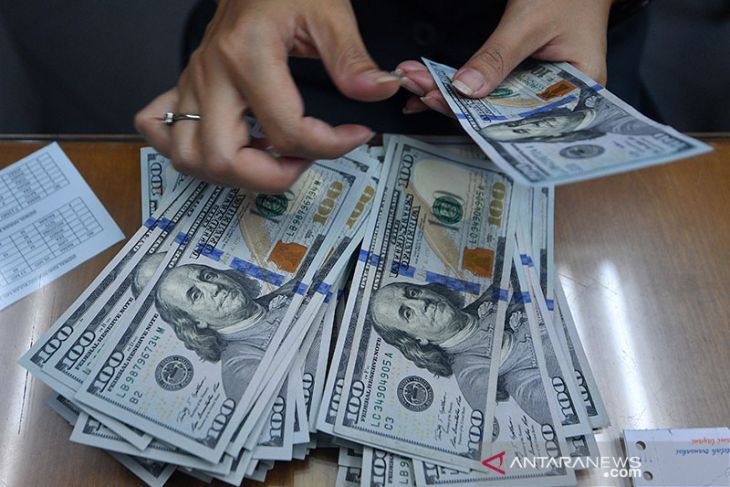 Dolar pangkas kerugian, Powell indikasikan pengurangan beli obligasi