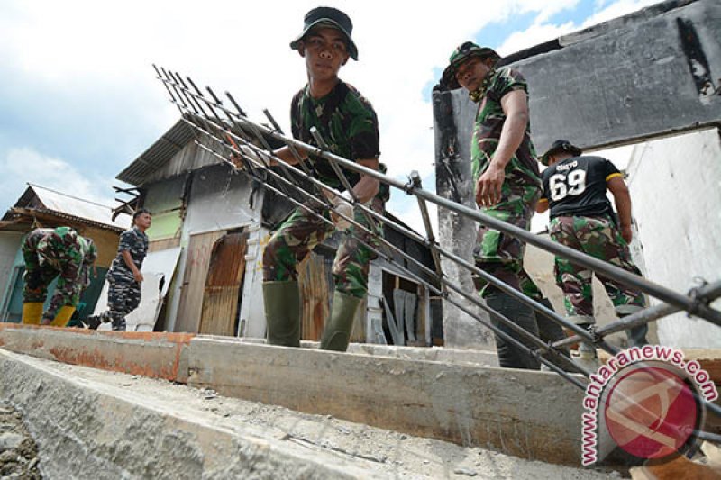 TNI REHABIITASI PASAR MASOMBA