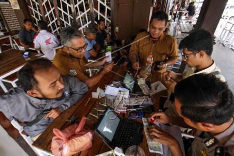 Layanan Jemput Pajak Kenderaan Di Warung Kopi