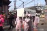 COVID-19: Employees parade coffin in Cakung densely populated area
